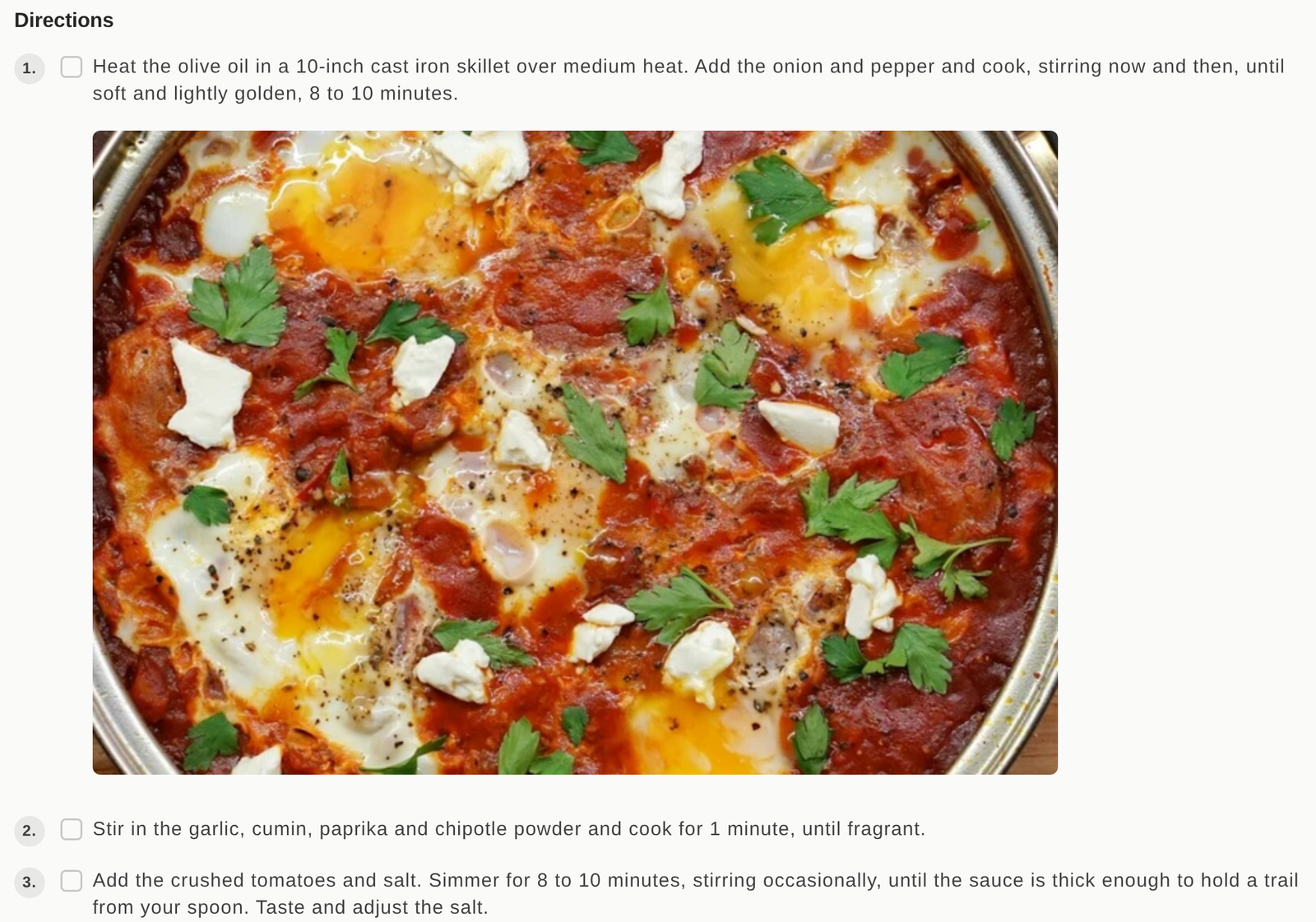 A recipe card with a photo shown under the text of one direction step