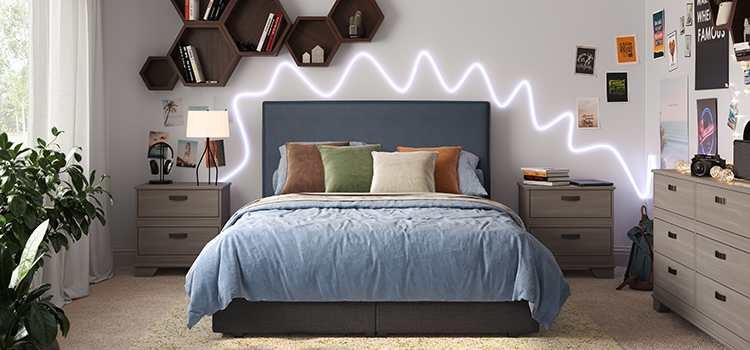 Bedroom decorated with wall hangings, plants, and neon lighting.