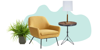 Yellow chair between a houseplant and side table