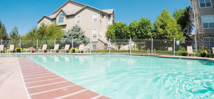 Apartment community outdoor pool on a sunny day.