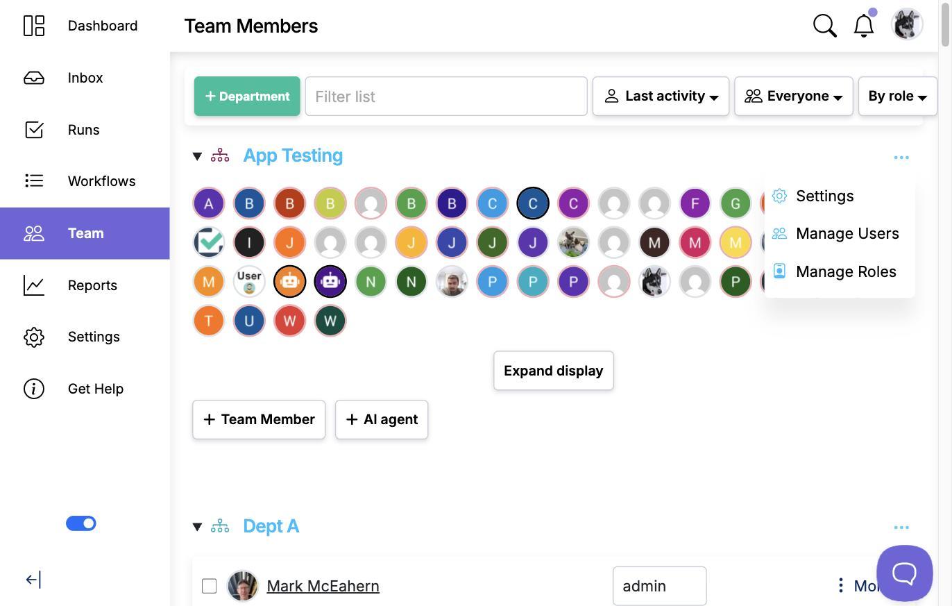 The Team Members page with a department's three-dot menu open, showing Settings, Manage Users and Manage Roles
