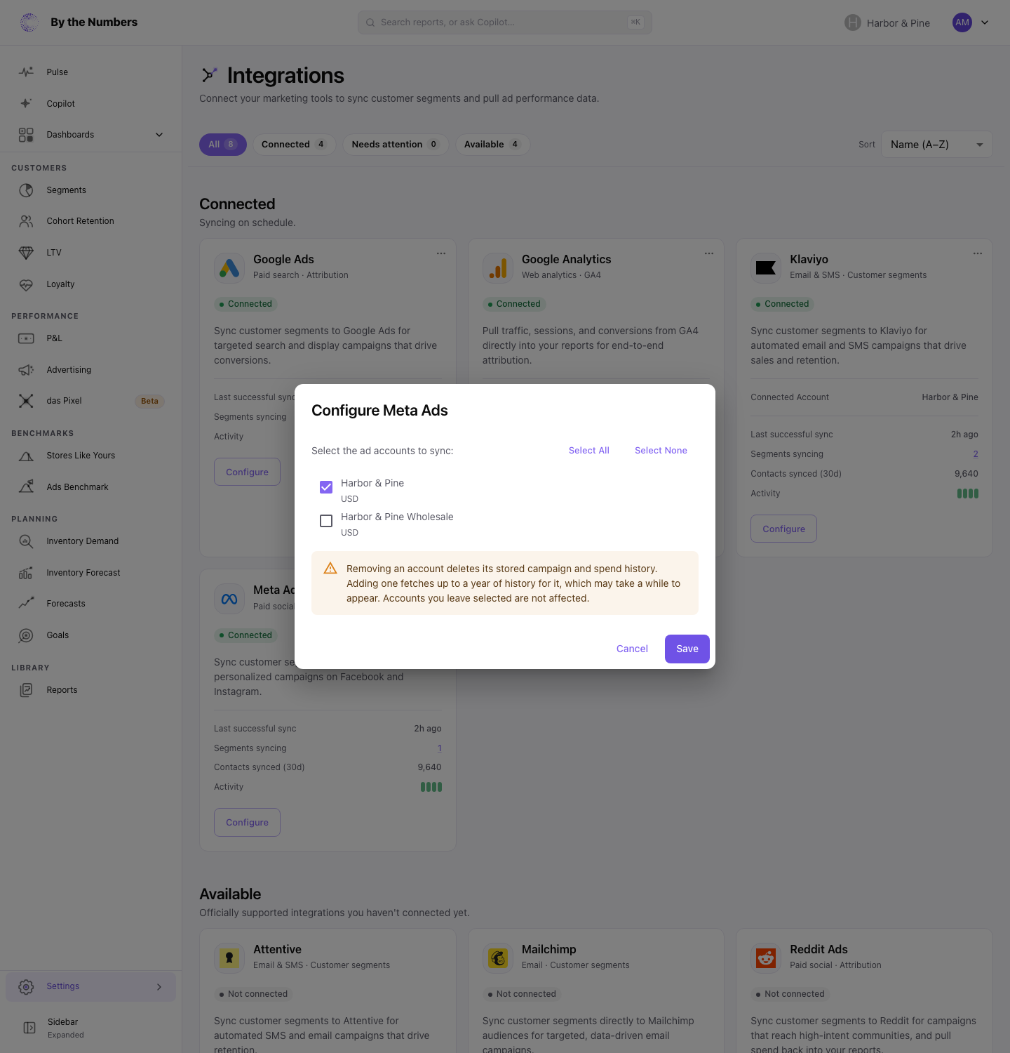 The Configure Meta Ads dialog, with a checkbox for each Meta ad account to sync.