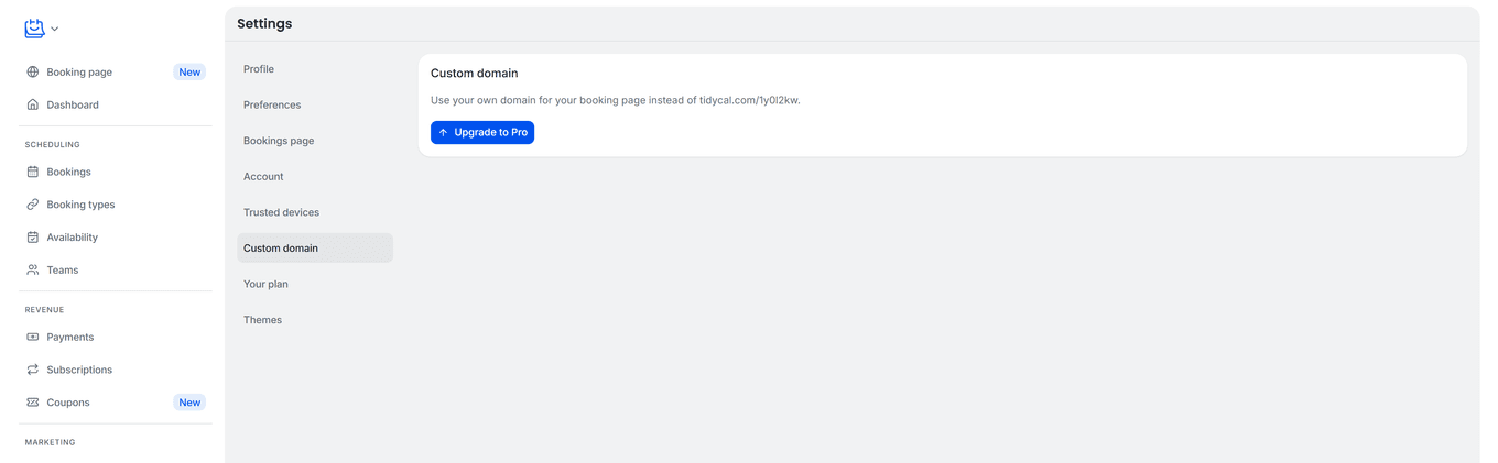 TidyCal Settings page on Free plan showing Custom domain card with Upgrade to Pro button