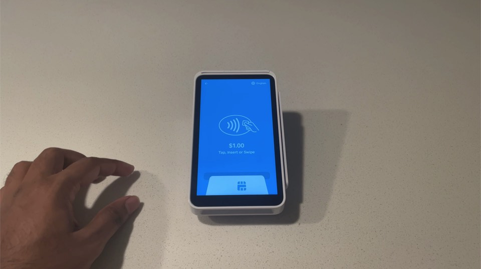 Square Terminal displaying the amount and Tap, Insert or Swipe