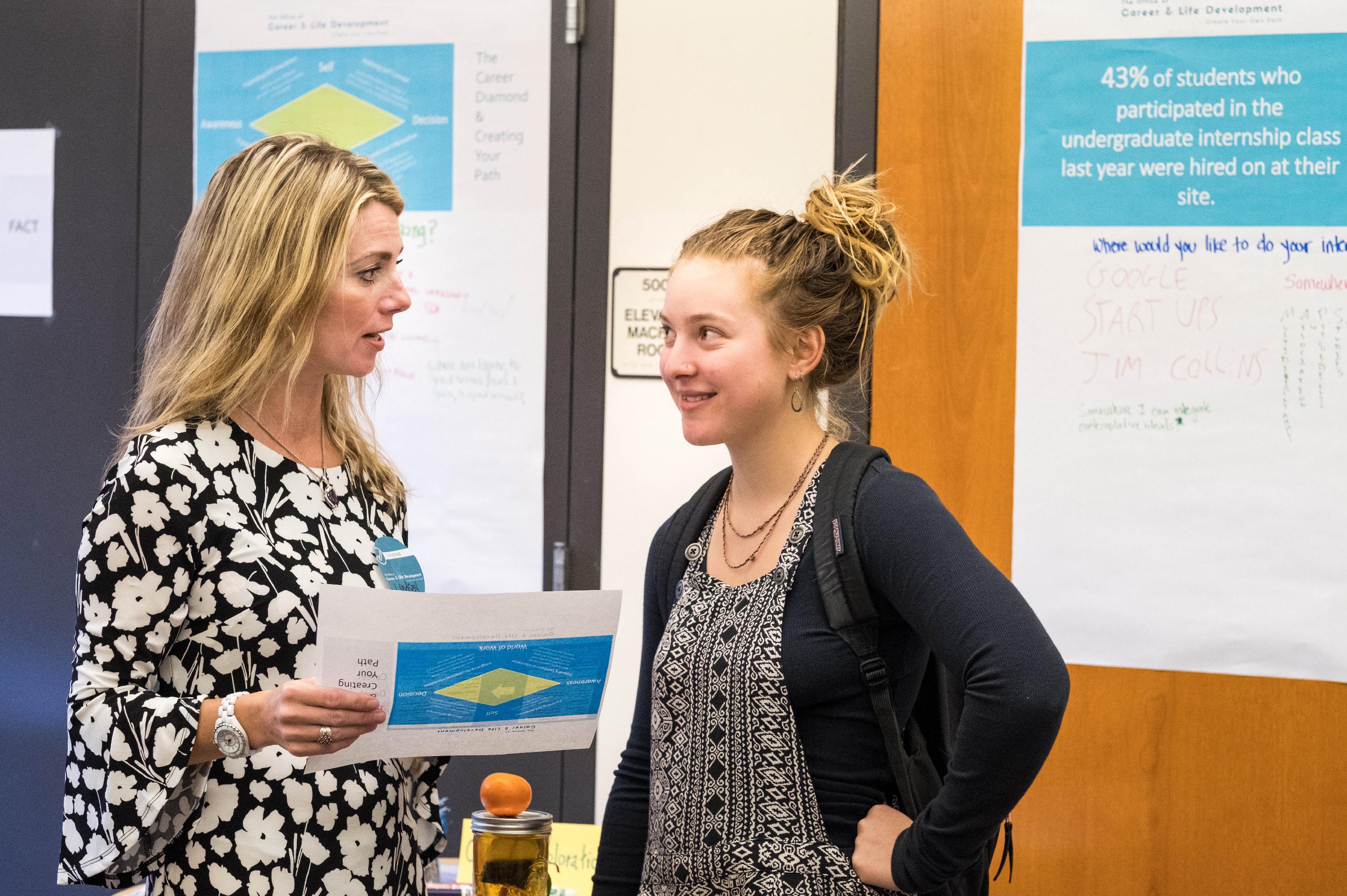 Teacher and student talking at career and life development lunch 
