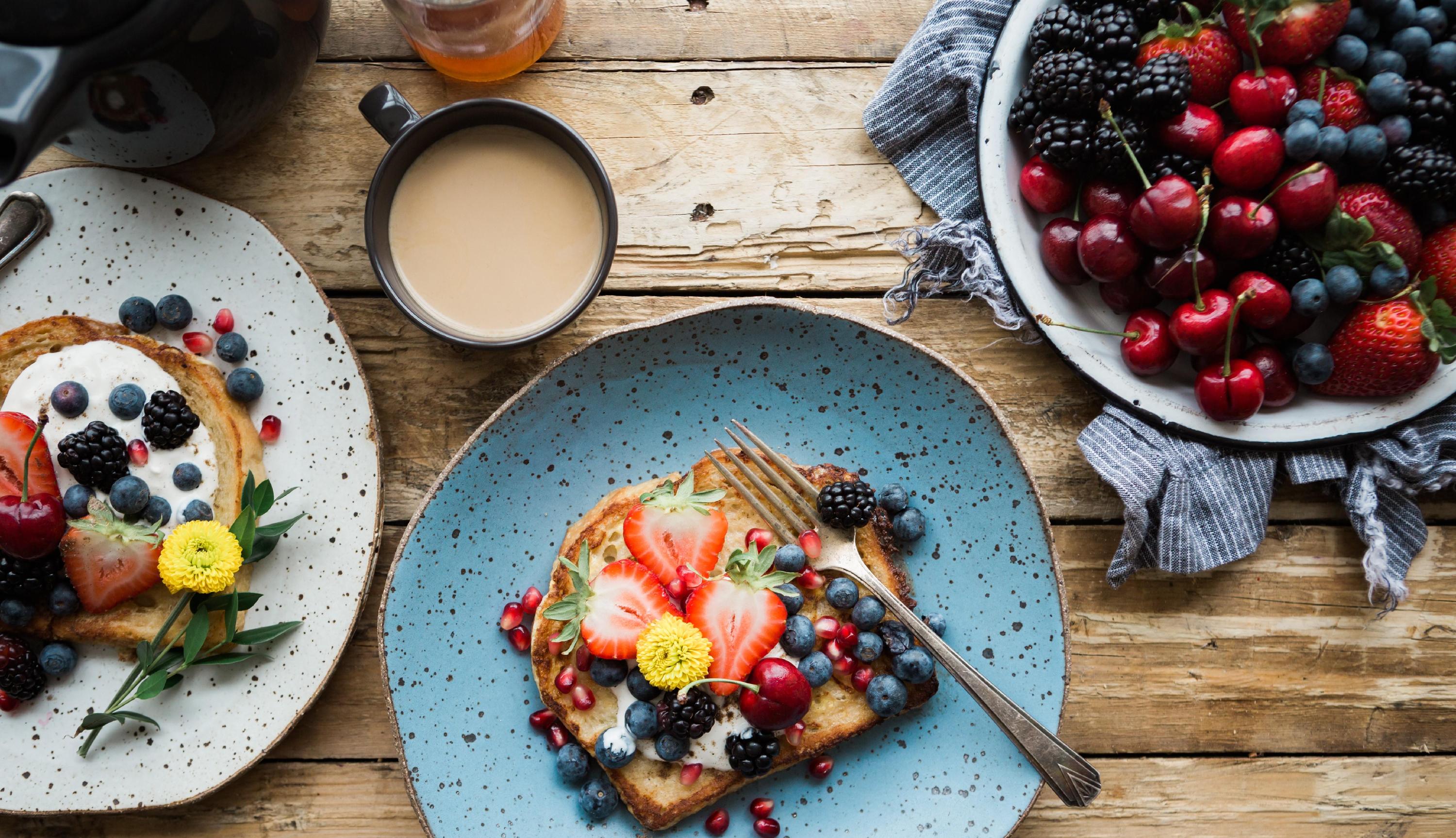 plates of breakfast foods on a table