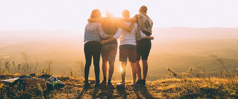 students with arms around each other