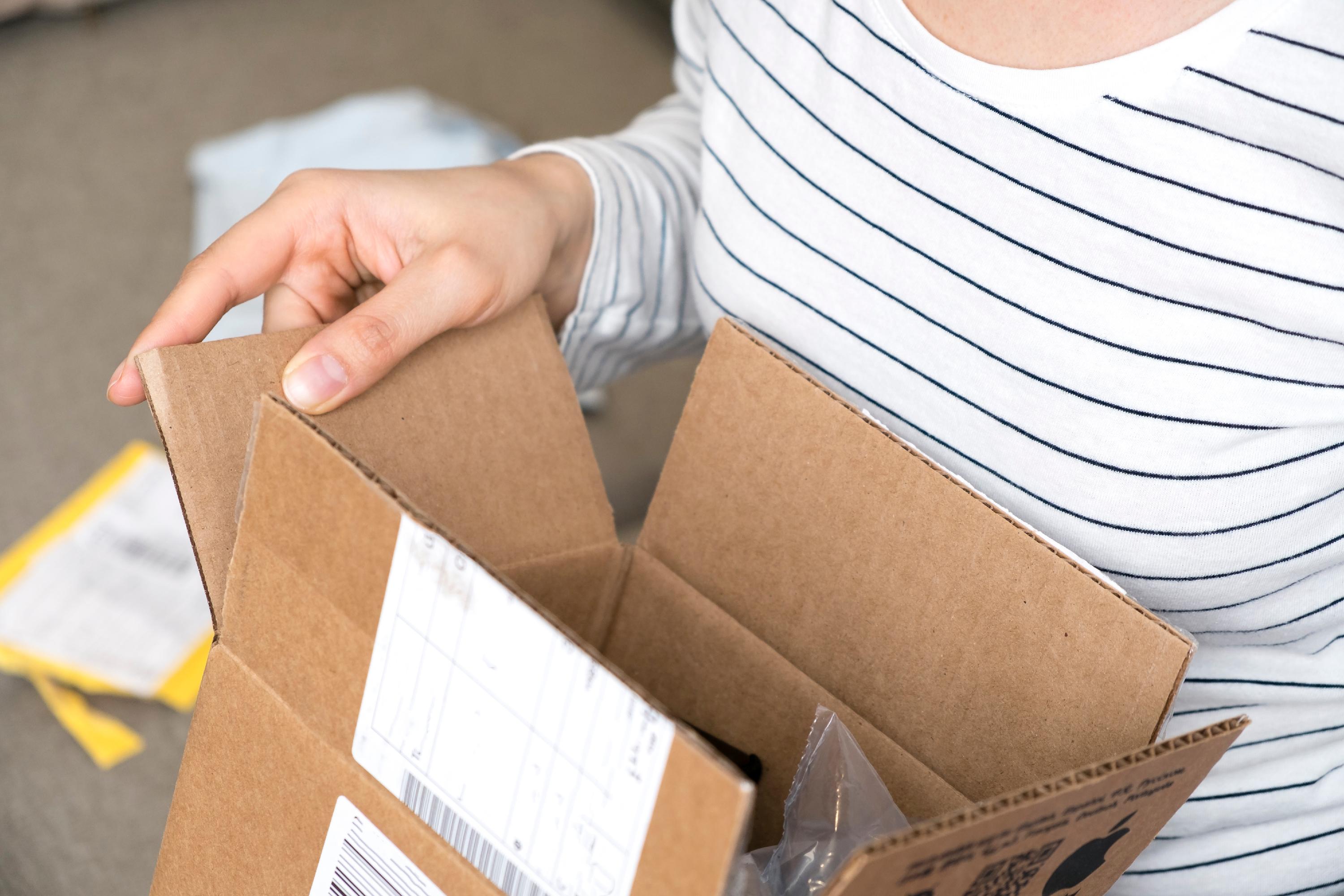 Close-up of someone holding a small opened package.