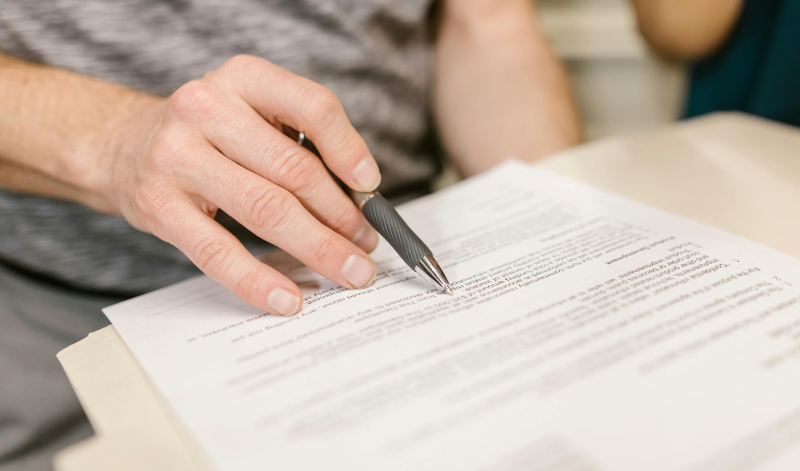Close-up of someone reviewing printed document.