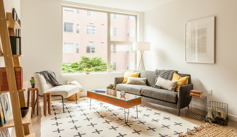 Bright, decorated apartment with a large window.