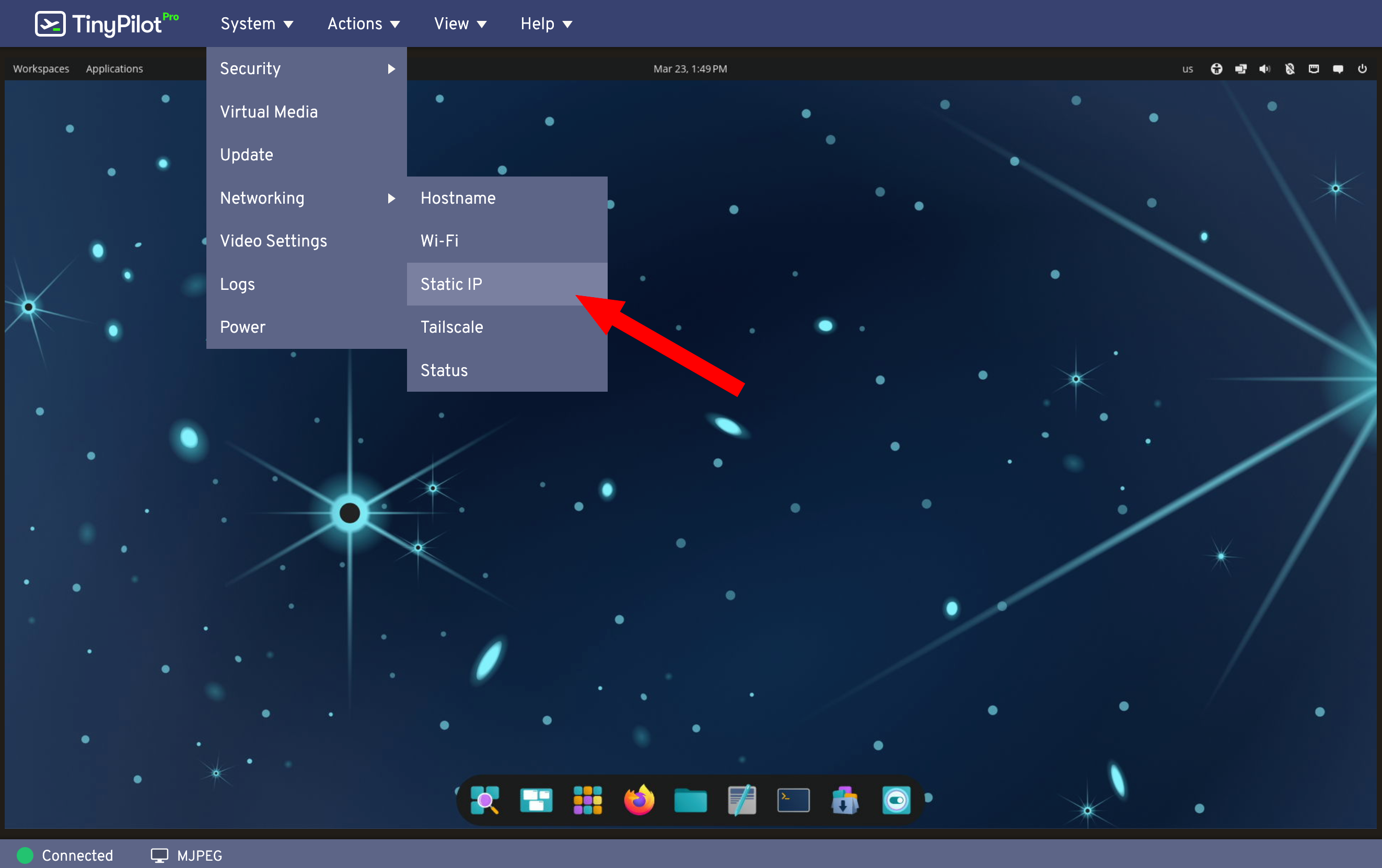 A screenshot of TinyPilot's web interface. The 'system' menu is open, along with the 'Networking' submenu. The 'Networking' submenu shows 'Static IP' highlighted. A red arrow points to the 'Static IP' menu item.