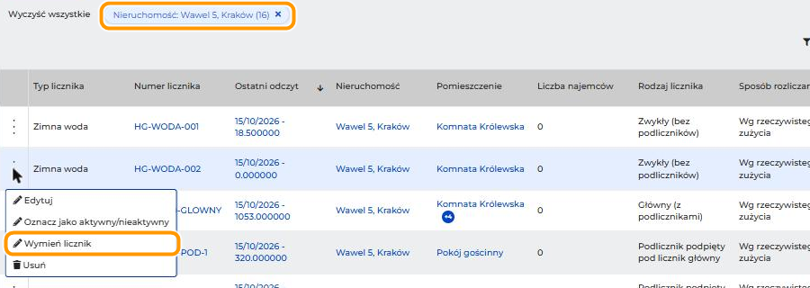Lista liczników w menu Media z filtrem Nieruchomość: Wawel 5, Kraków (16) i otwartym menu licznika HG-WODA-002. W pomarańczowych ramkach są aktywny filtr i opcja Wymień licznik.