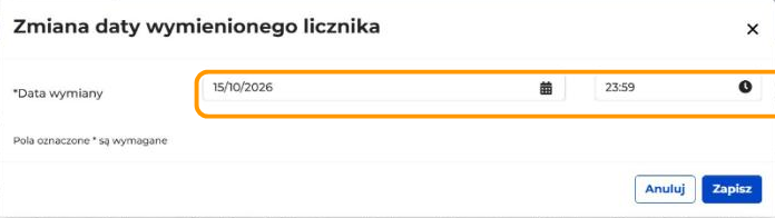 Okno Zmiana daty wymienionego licznika z polem Data wymiany: data 15/10/2026 i godzina 23:59. Pola daty i godziny są w pomarańczowej ramce.