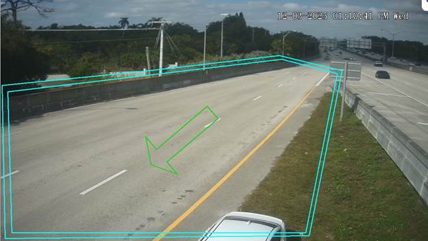 The image shows a two-lane highway with a green arrow on the right side of the lane, indicating a left turn, and the date and time are displayed at the top right corner.

AI-generated content may be incorrect.