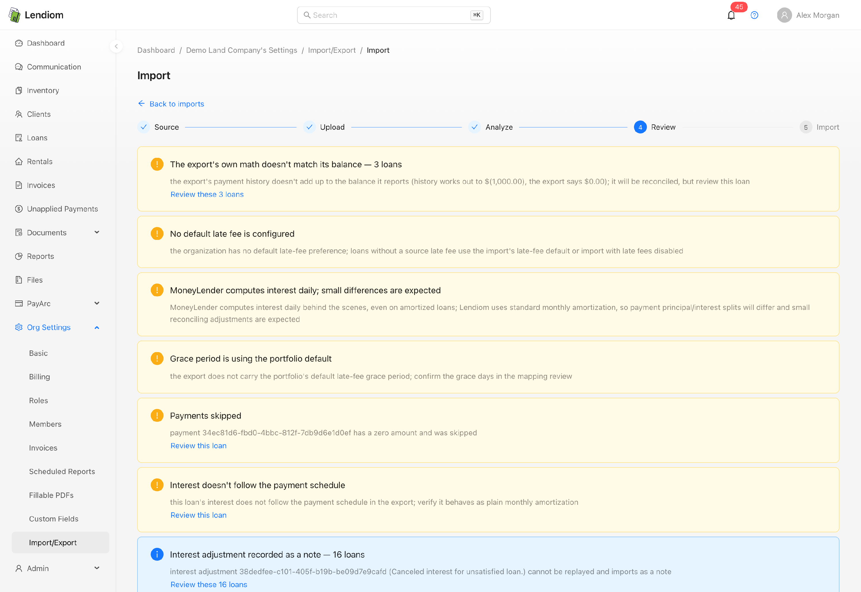 The Review step of the import, grouping every flagged loan for checking before anything is written
