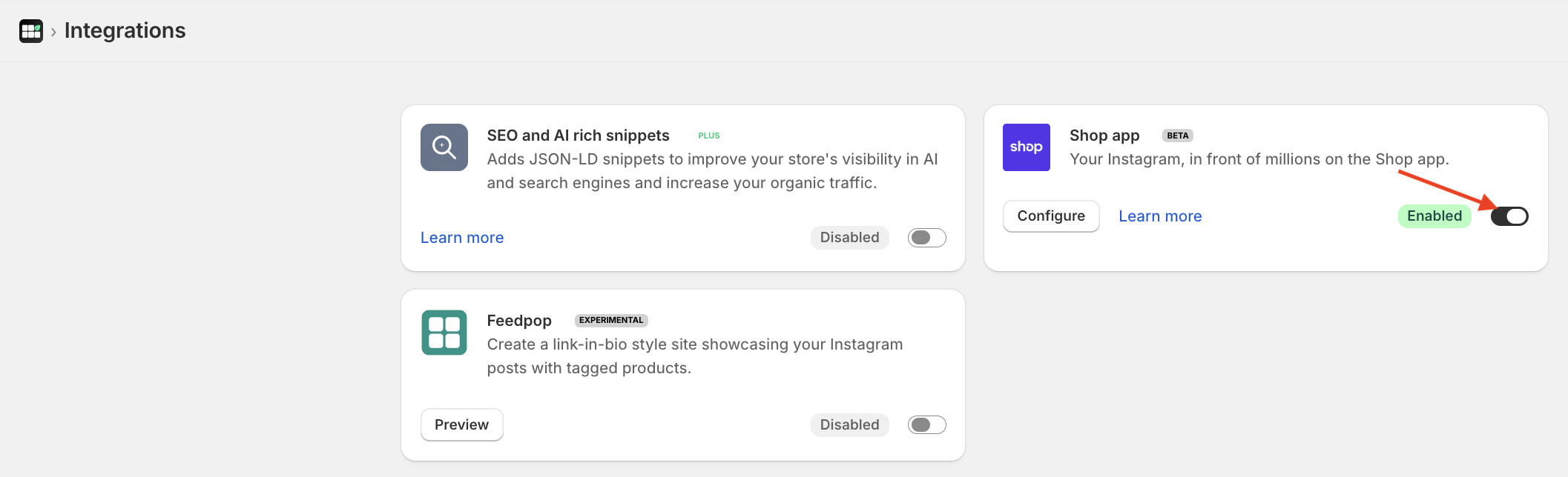 Screenshot of Instafeed app integrations page, with a red arrow pointing to the Enabled toggle.