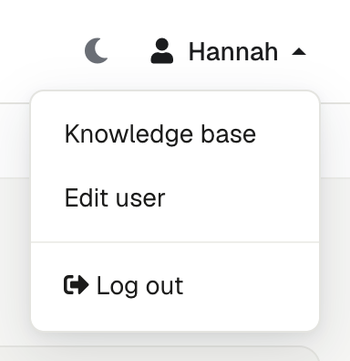 The moon button in the header, to the left of the user menu, which is open to show Knowledge base, Edit user and Log out.