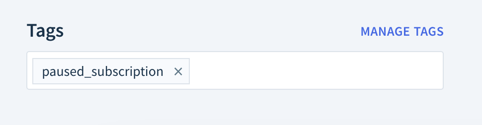 Screenshot of a customer record's Tags section with one tag, paused_subscription